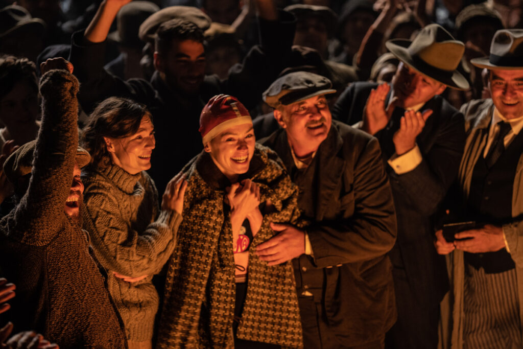 (L-R): Jeanette Hain as Gertrud Ederle, Daisy Ridley as Trudy Ederle, and Kim Bodnia as Henry Ederle in Disney's live-action YOUNG WOMAN AND THE SEA. Photo by Vladisav Lepoev. © 2024 Disney Enterprises, Inc. All Rights Reserved.